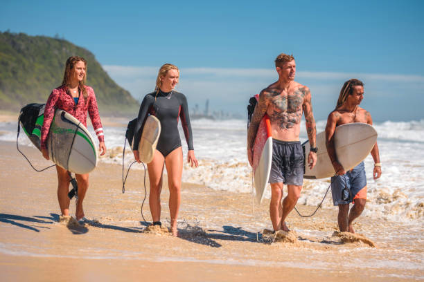 istock Tallebudgera Beach Surfing Friends Walking at Water’s Edge 1295227351