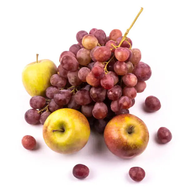 Photo of Bunch of grapes and apples on white background