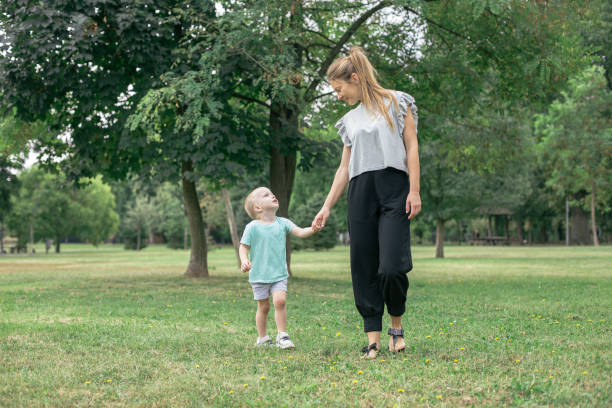 istock Young Mother And Son In The Park 1295230842