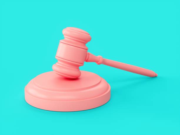 istock 3D rendering pink gavel, Judge Hammer on blue background 1295231554