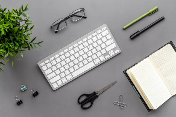 istock Workplace flat lay with computer and office supplies top view 1295232461