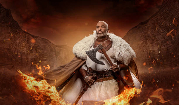 Weapon wielding viking inspired black african warrior in a fantasy fire setting