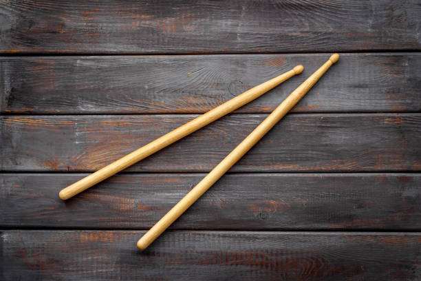 istock Two wooden drum sticks, top view. Music background 1295232954