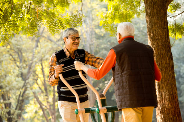 istock Senior friends exercising at open air gym 1295233193