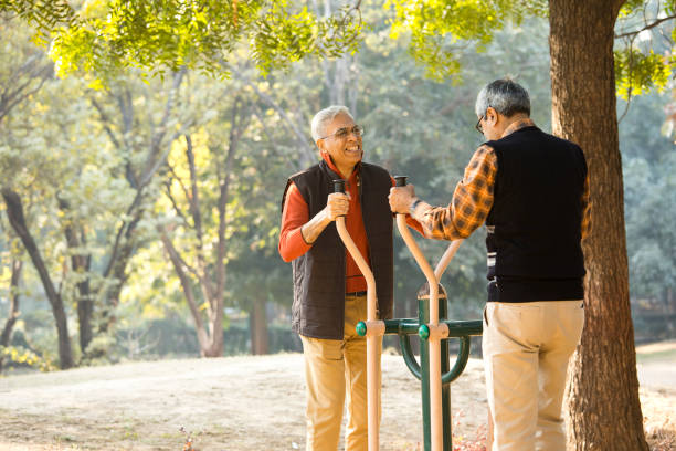 istock Senior friends exercising at open air gym 1295233583