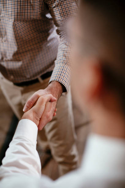 istock Close up of men handshake in office 1295234800