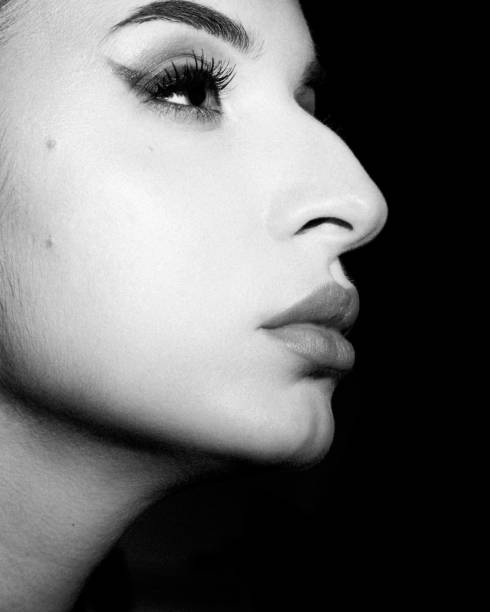 istock monochrome woman's beauty portrait with professional make up and chubby lips 1295236739