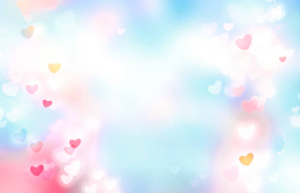 istock Pink and blue blurred hearts bokeh,valentine's background.Romantic glowing texture.Love concept illustration. 1295238338
