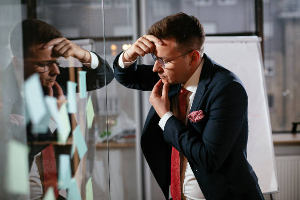 istock Tired businessman making a business plan. 1295240630