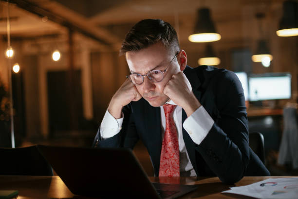 istock Tired businessman in the office. Exhausted 1295242504