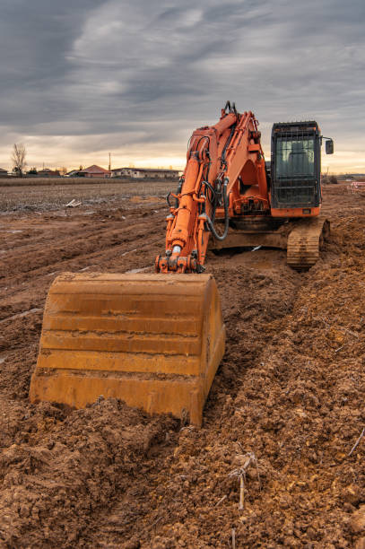 istock Excavator doing work on a wet and muddy winter day 1295242960