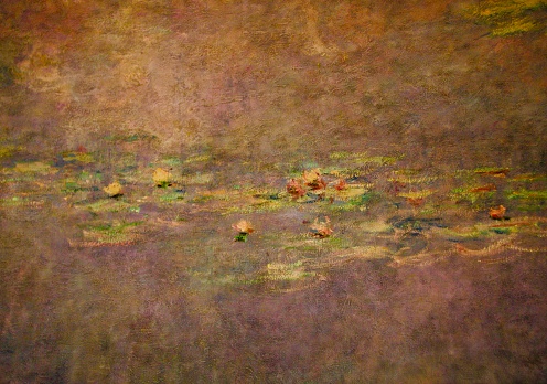 Closeup photo of a section of Impressionist painter Claude Monet’s Waterlily paintings in the Musee de l’Orangerie in Paris