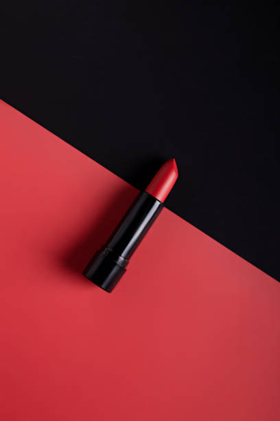 istock Make up layout made with red lipstick on dual tone red and black background 1295248223