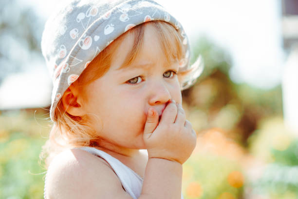 istock child in the garden with berries 1295251954