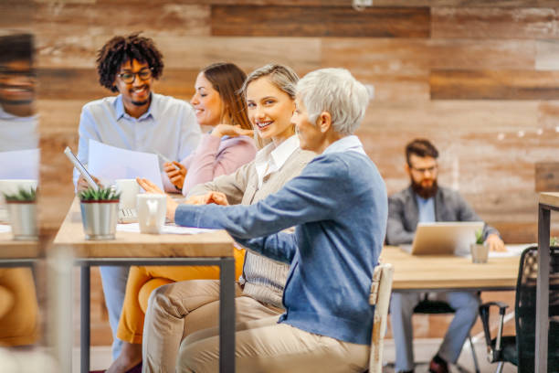 istock Modern business. Colleagues having a coffee break. 1295252422