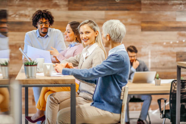 istock Modern business. Colleagues having a coffee break. 1295252543
