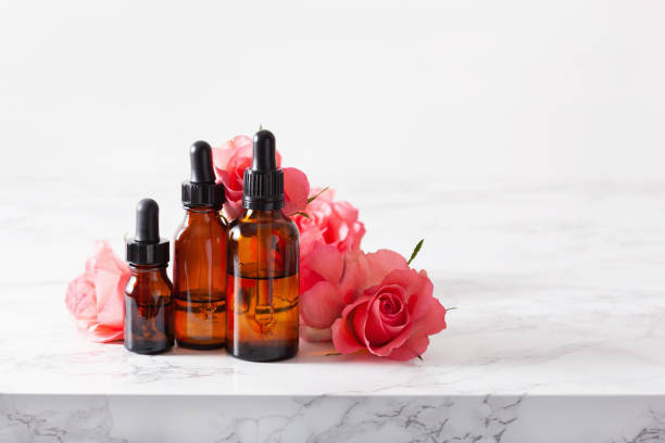 istock essential oils in bottles rose flowers. alternative medicine aromatherapy 1295252560