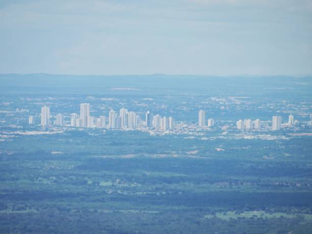 Cuiaba city seen from the top of a cliff Cuiaba city seen from the top of a cliff. Shot in Chapada dos Guimarães, Mato Grosso, Brazil. cuiabá stock pictures, royalty-free photos & images
