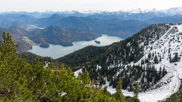 istock View on Walchensee lake and surrounding mountains (alps). Partly covered with snow. 1295256244