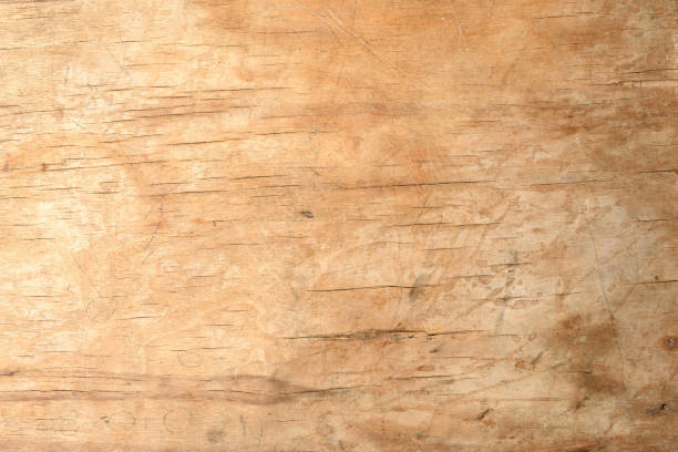 istock texture of a old brown wooden cutting board, full frame, backdrop for the designer 1295259106