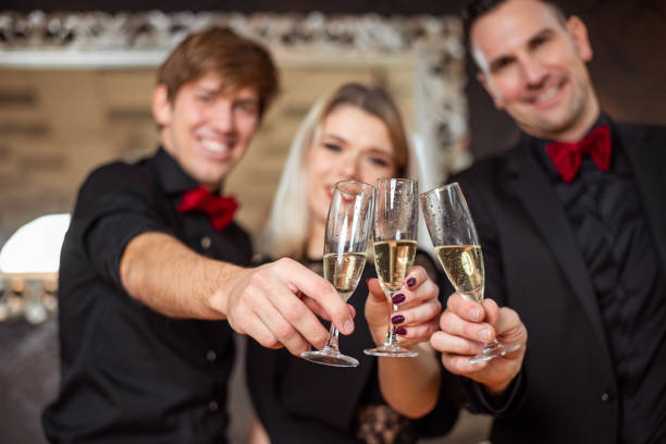 istock Young friends toasting with champagne glasses 1295262322