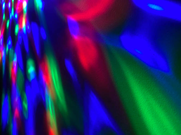 istock Background of psychedelic coloured light effects on wall 1295264029