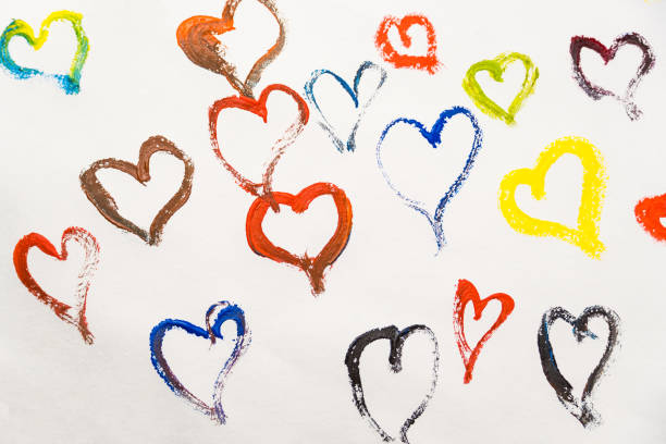 istock Colored hearts on a white background, painted with paints on a white background. 1295264812