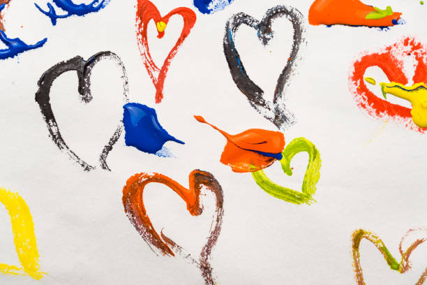 istock Colored hearts are smeared with paints on a white background. 1295264991