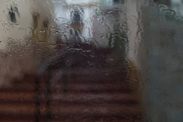 istock Raindrops falling on a window creating a pictorial effect on the image 1295266267