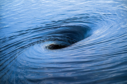 Huge whirlpool on a water surface