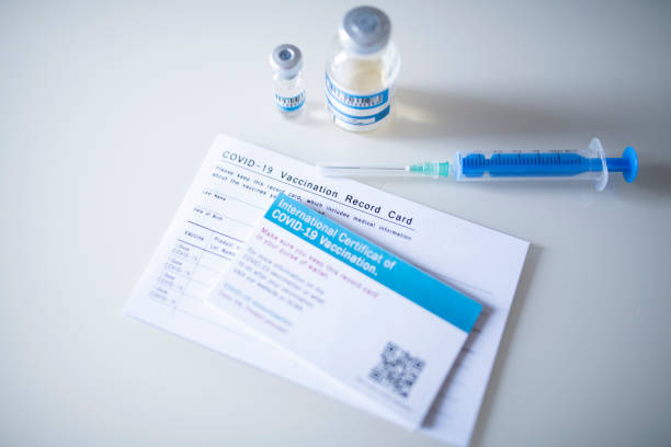 istock Vaccination Record Card And Certificate Of Covid-19 vaccination. 1295268247
