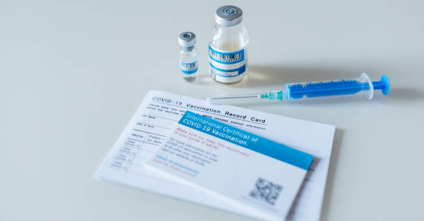 istock Vaccination Record Card And Certificate Of Covid-19 vaccination. 1295268251