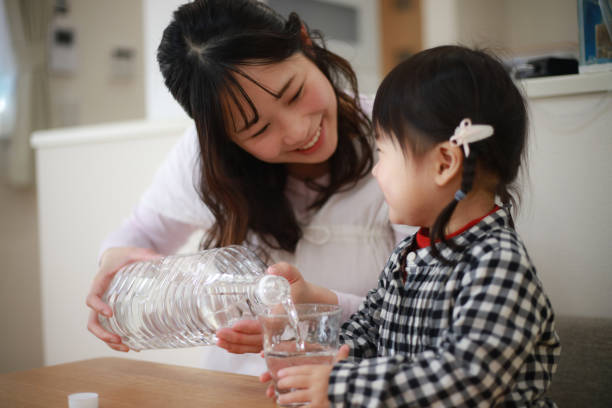 istock Parents and children drinking water 1295268984