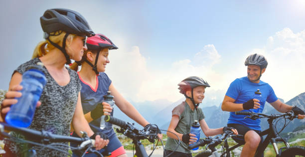 istock Family taking break during mountain biking 1295269790