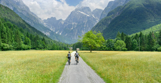 istock Couple riding mountain bike 1295269849