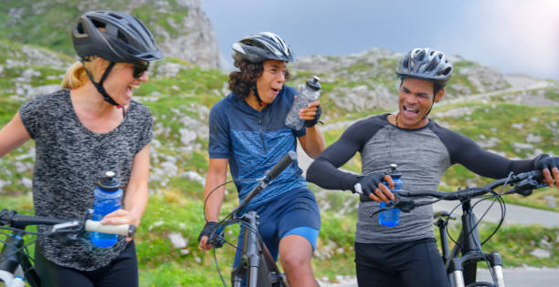 istock Family taking break during mountain biking 1295269857