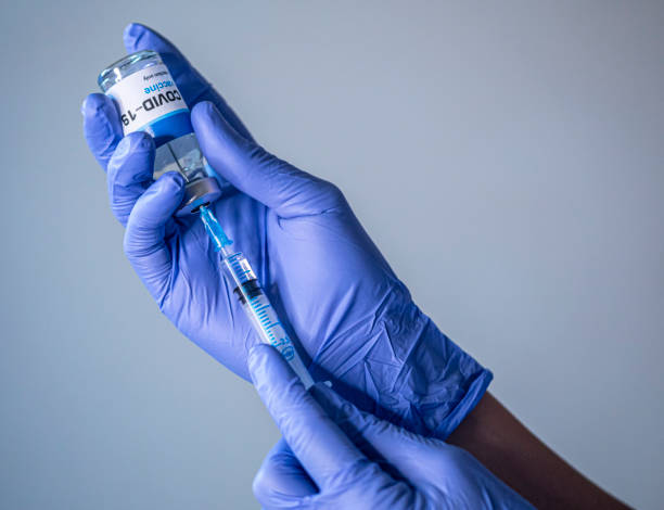 istock COVID-19 coronavirus vaccine in doctor hands 1295271224