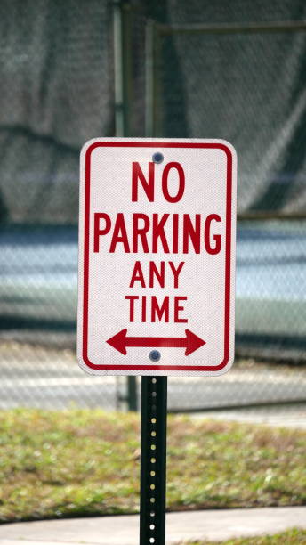 istock 'No parking at any time' street sign 1295276746