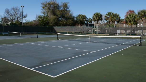 istock Two empty tennis courts in summer 1295276812