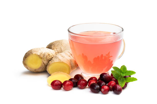 Tea with ginger root and cranberry isolated on white background