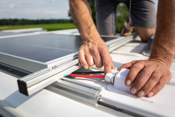 Solar panel connecting cables on top of a camper van stock photo