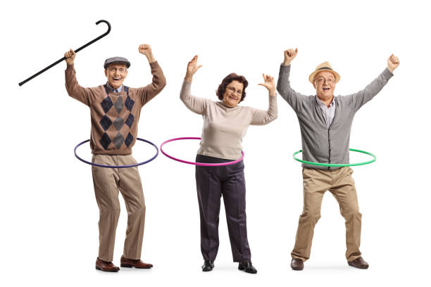 istock Happy elderly people spinning hula hoops 1295283195