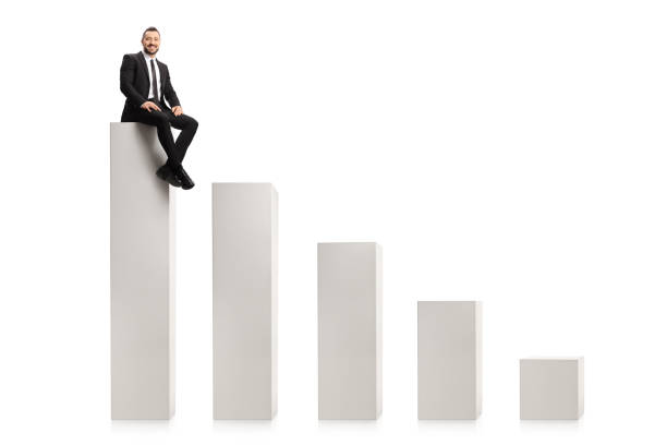 istock Businessman sitting on the highest column in a chart 1295285643