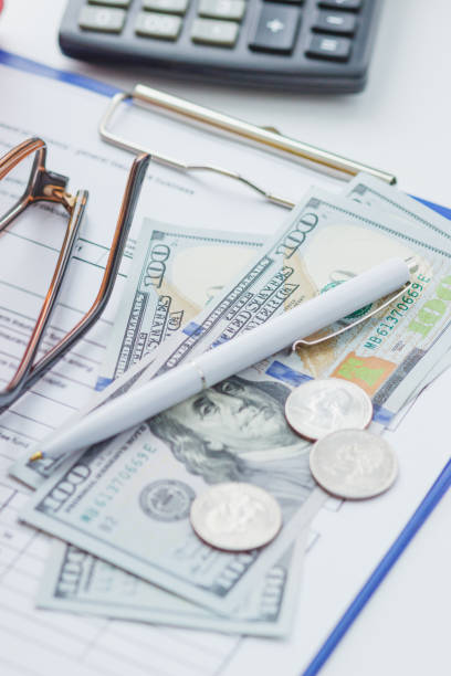istock Clean insurance form, glasses and money 1295286645