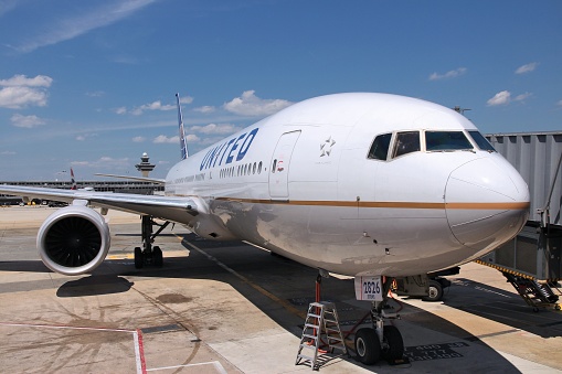 United Airlines Boeing 777-200 at Dulles International Airport in Washington, DC, USA. The airline had 400 million USD operating income in 2013.