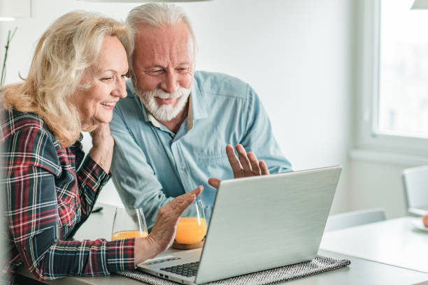 istock Seniors are communicating on a video call 1295293821