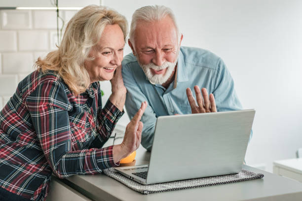 istock Seniors are communicating on a video call 1295293887