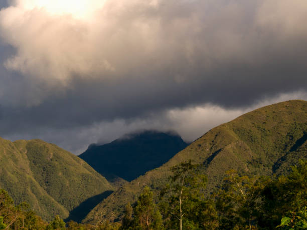 The Iguaque mountain, in the central Andean mountains of Colombia, covered by dense clouds at sunset.