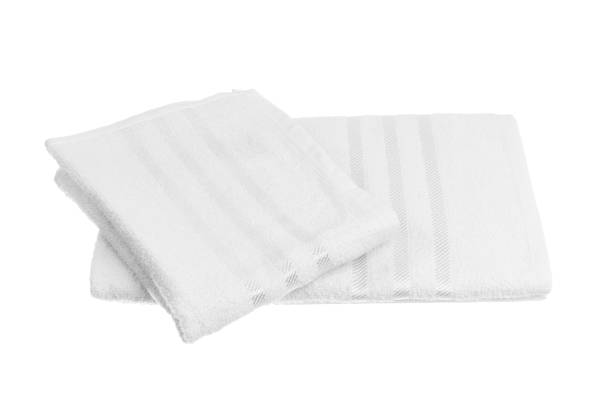 istock stack of colorful towels isolated on white. 1295298637