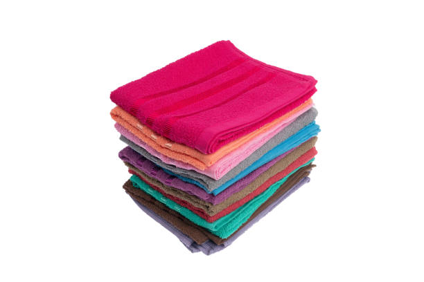 istock stack of colorful towels isolated on white. 1295299106